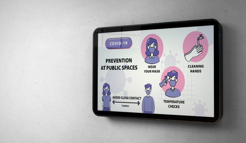 a digital signage television screen showing covid-19 safety instructions