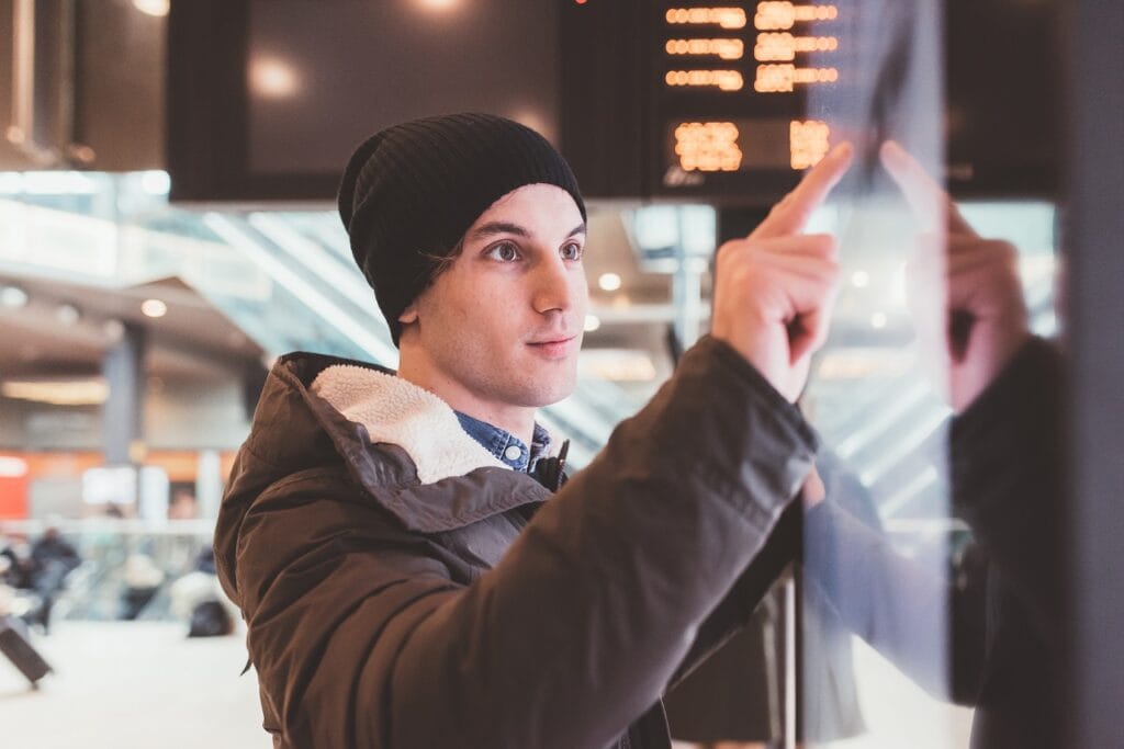 A men using a television screens for interactive advertising or communication